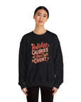 Person wearing a black sweatshirt with 'Holiday Calories Don't Count' text on a white background
