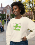 Woman wearing a cream sweatshirt with text and a graphic on a white background