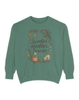 Green sweatshirt with 'Sweater Weather Forever' text and illustrations on a white background