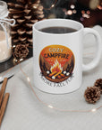 White mug with 'Cozy Campfire' design on a table with candles, oranges, and pinecones.