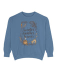Blue sweatshirt with 'Sweater Weather Forever' text and graphics on a white background