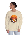Woman wearing a beige sweatshirt with a campfire graphic and text on a white background