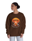 Woman wearing a brown sweatshirt with a campfire graphic and text on a white background