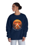 Person wearing a navy sweatshirt with a campfire graphic and text on a white background