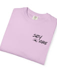 Folded light purple t-shirt with 'Salty Vibes' text on a white background