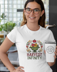 Woman wearing a white t-shirt with 'Harvest Infinity' design and holding a white tumbler.
