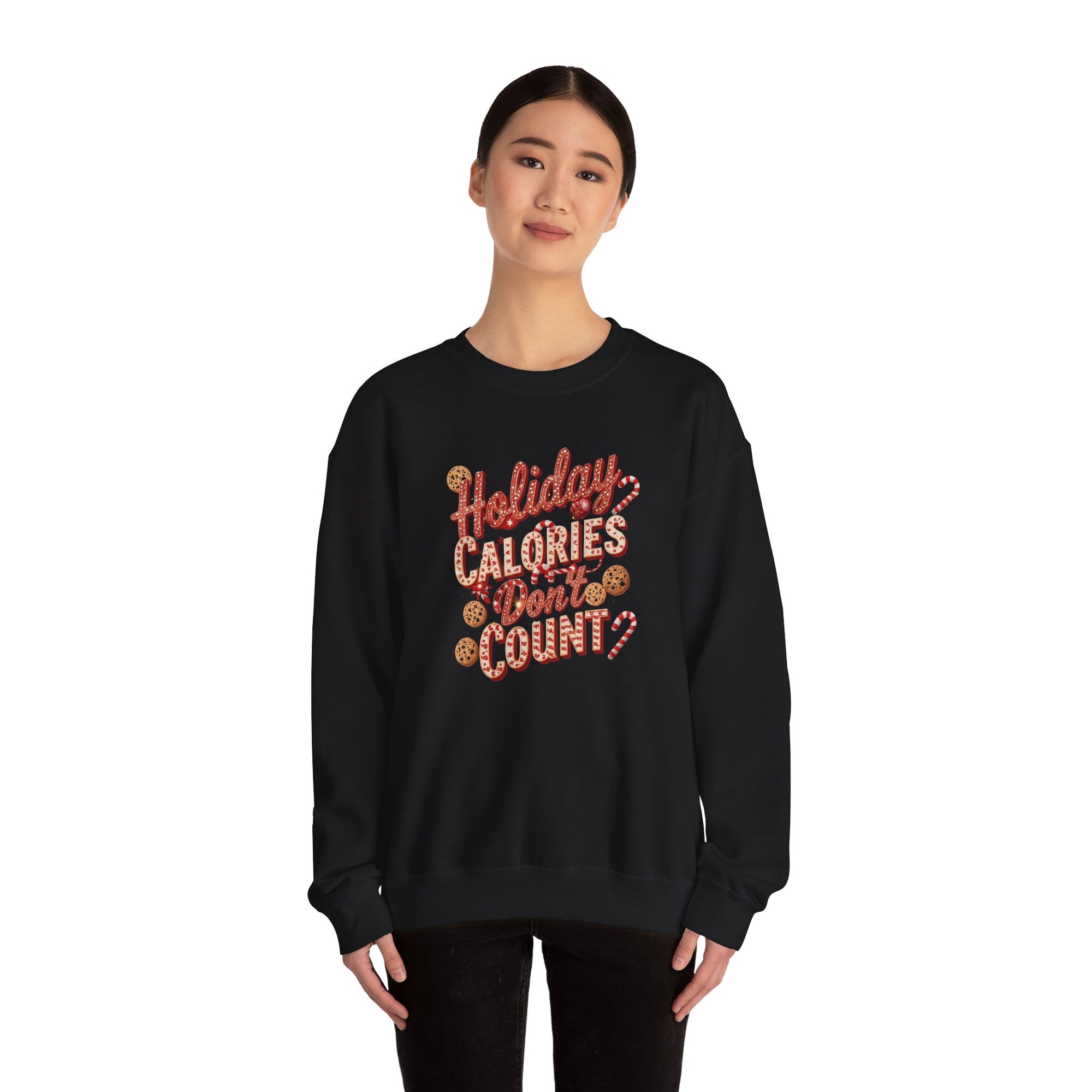 Person wearing a black sweatshirt with 'Holiday Calories Don't Count' text on a white background