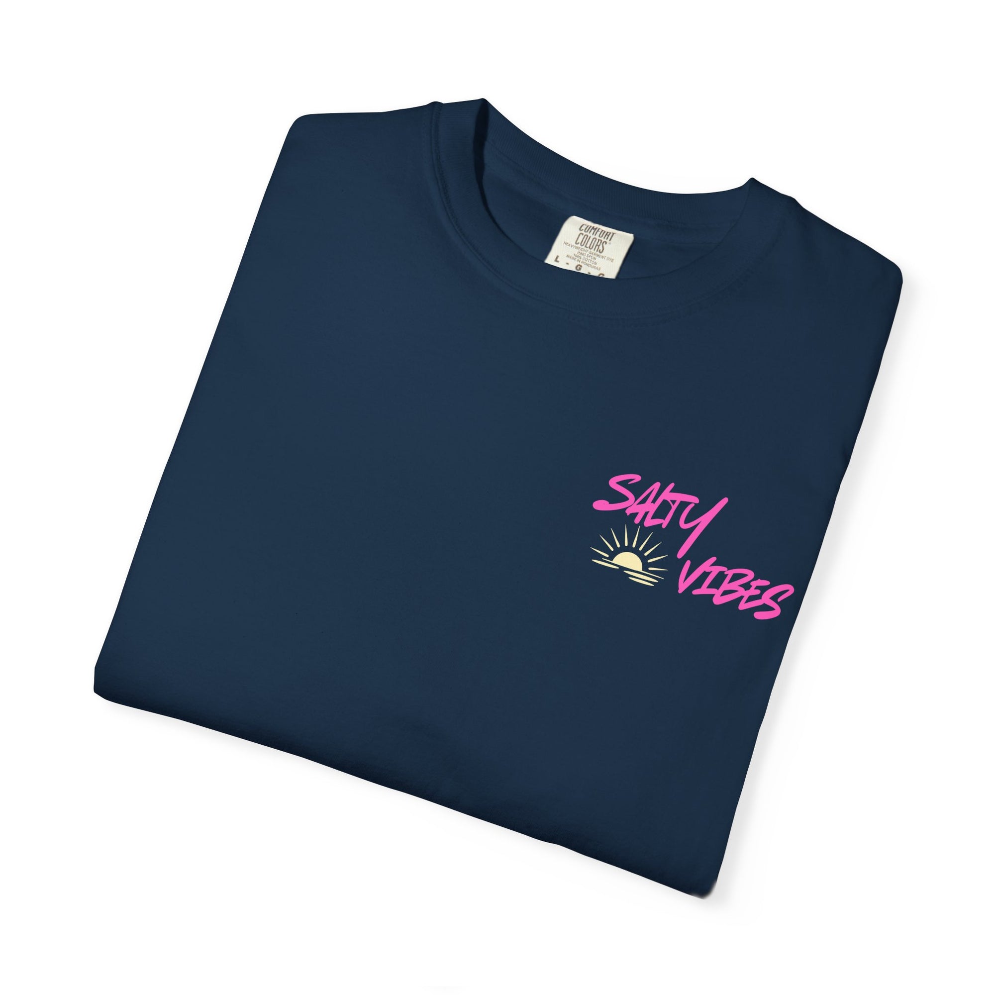 Folded navy blue t-shirt with motivational quote and mountain graphic on a white background