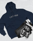 Navy hoodie with 'DAD' text, black jeans, and black sneakers on a light gray background
