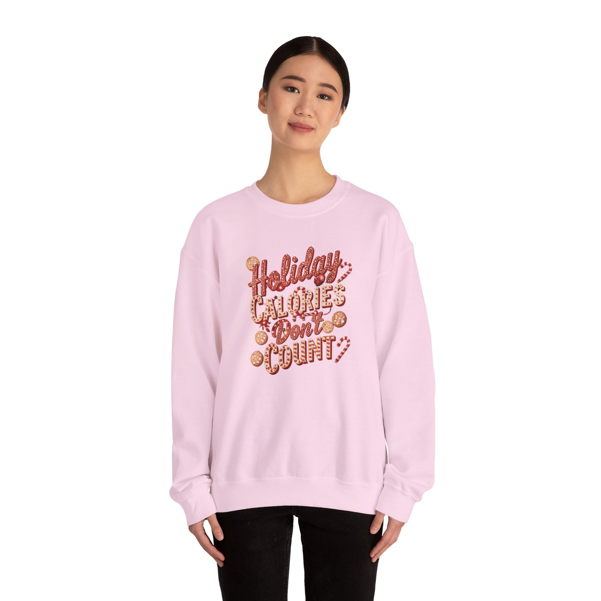 Person wearing a pink sweatshirt with text on a white background