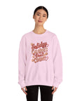 Person wearing a pink sweatshirt with text on a white background