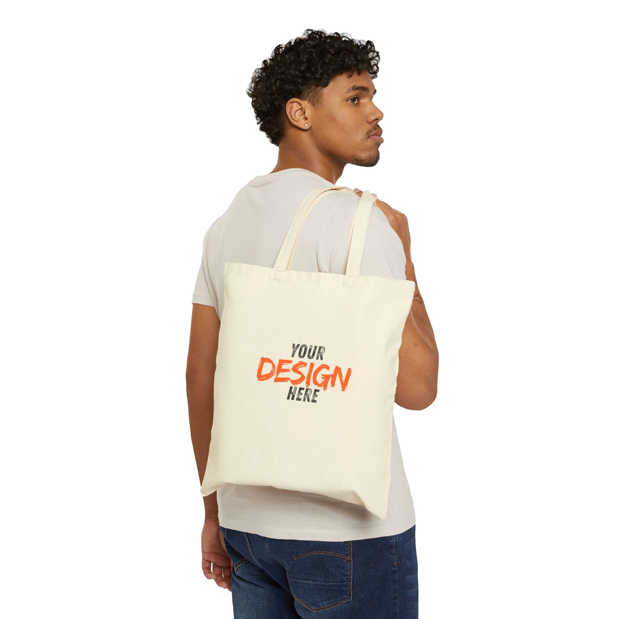 Man carrying a customizable tote bag with 'Your Design Here' text on a white background