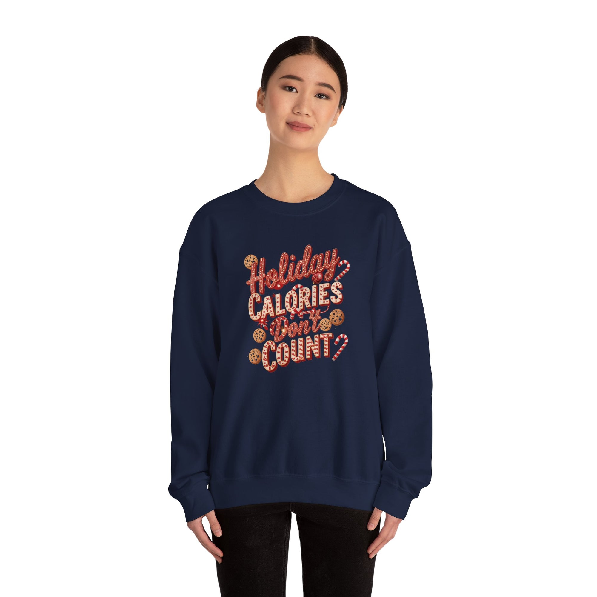Navy blue sweatshirt with &#39;Holiday Calories Don&#39;t Count&#39; text worn by a person on a white background
