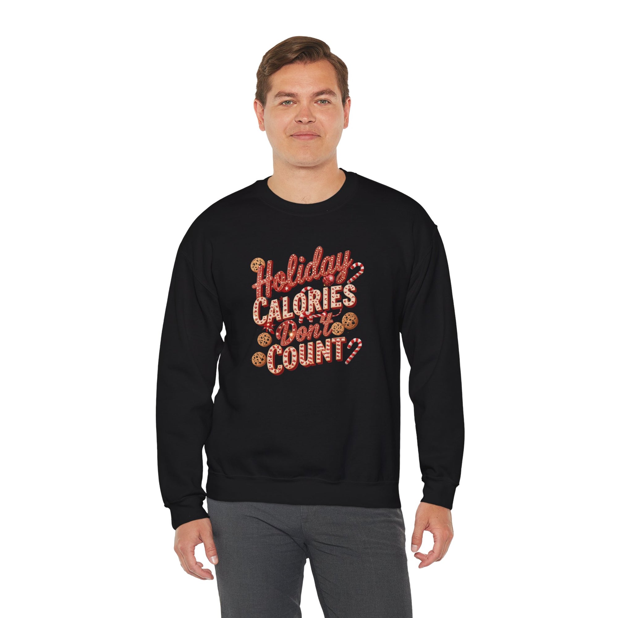 Man wearing a black sweatshirt with &#39;Holiday Calories Don&#39;t Count&#39; text on a white background