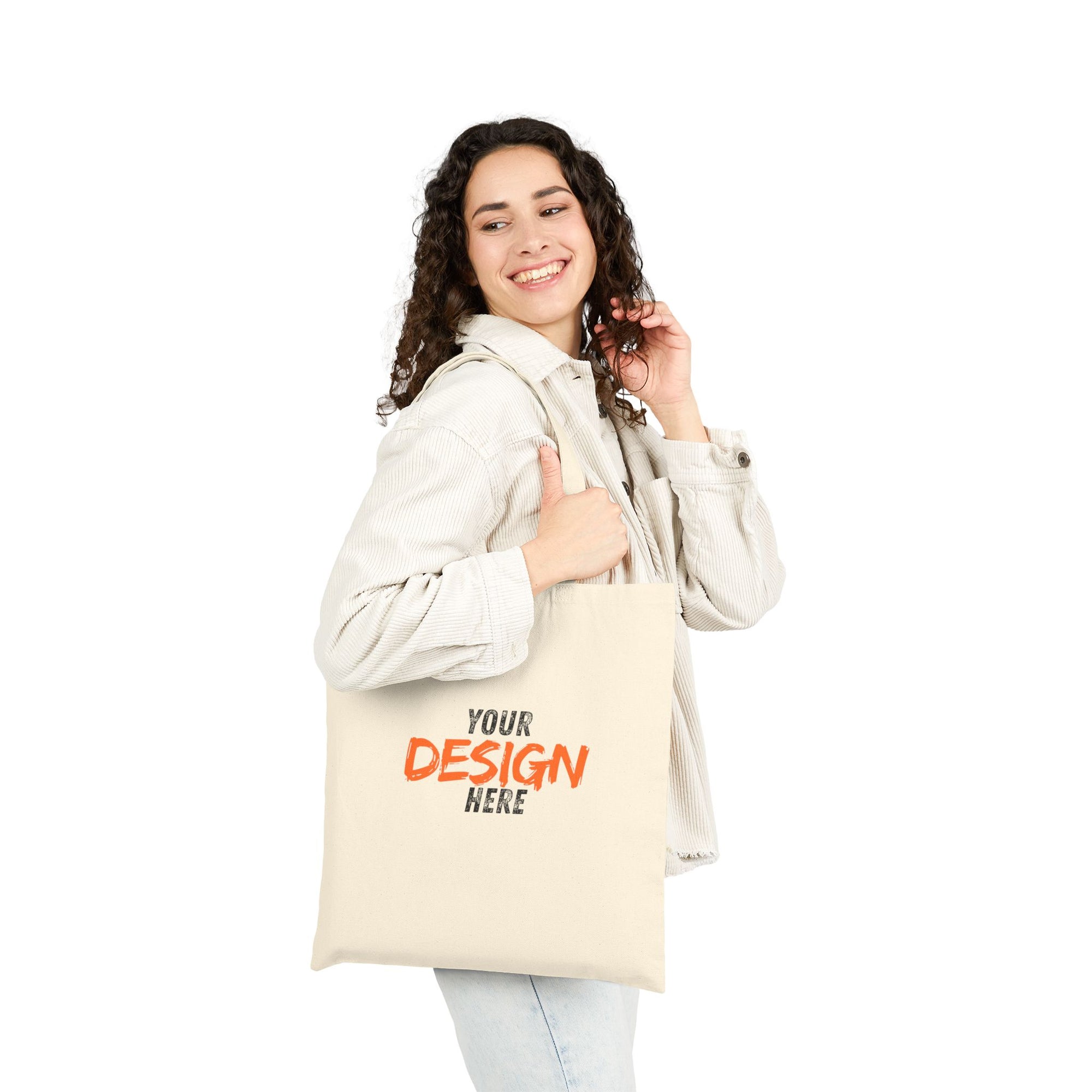 Woman holding a customizable tote bag with 'Your Design Here' text.