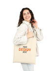 Woman holding a customizable tote bag with 'Your Design Here' text.