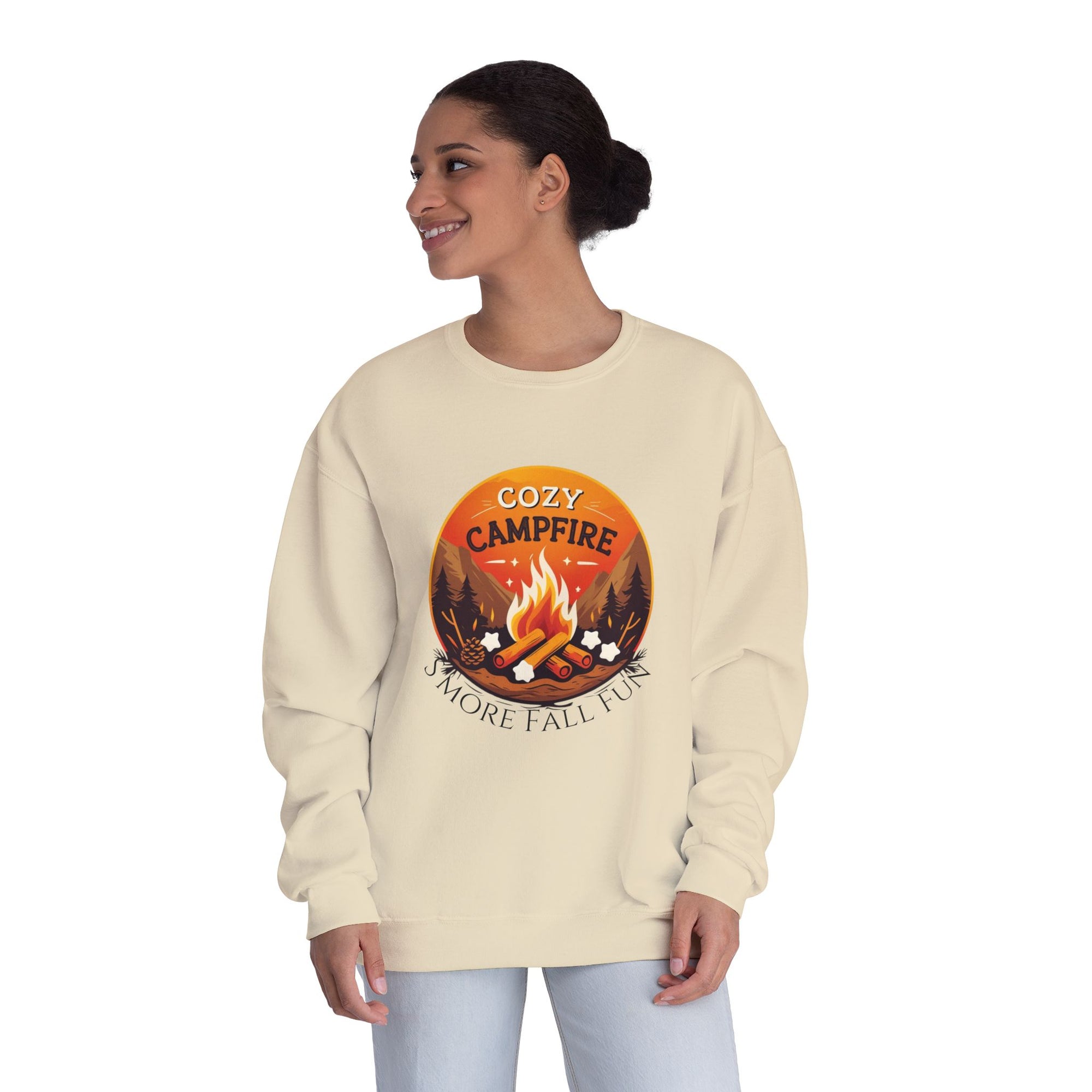Woman wearing a beige sweatshirt with a campfire graphic and text on a white background