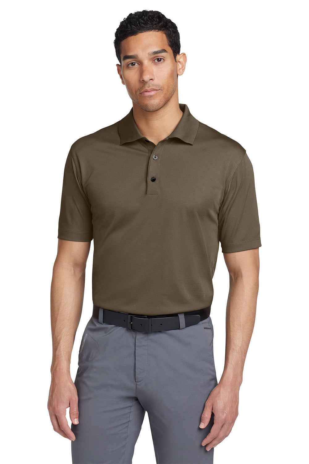 Man wearing a brown polo shirt and gray pants on a white background