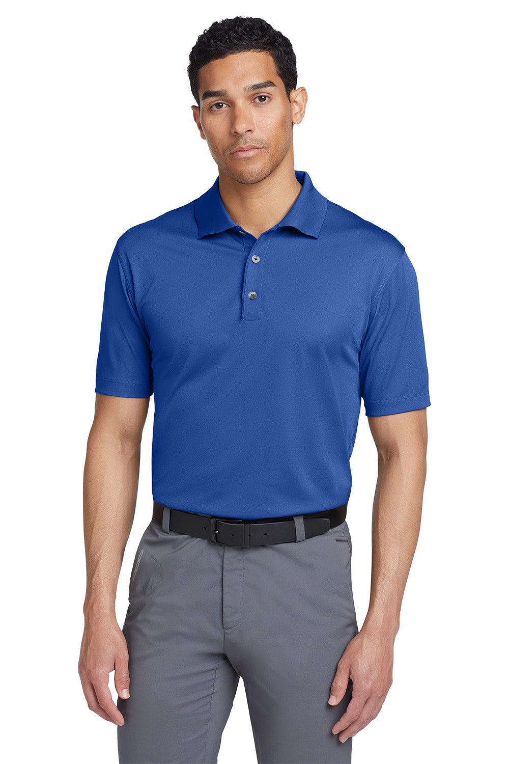 Man wearing a blue polo shirt and gray pants on a white background