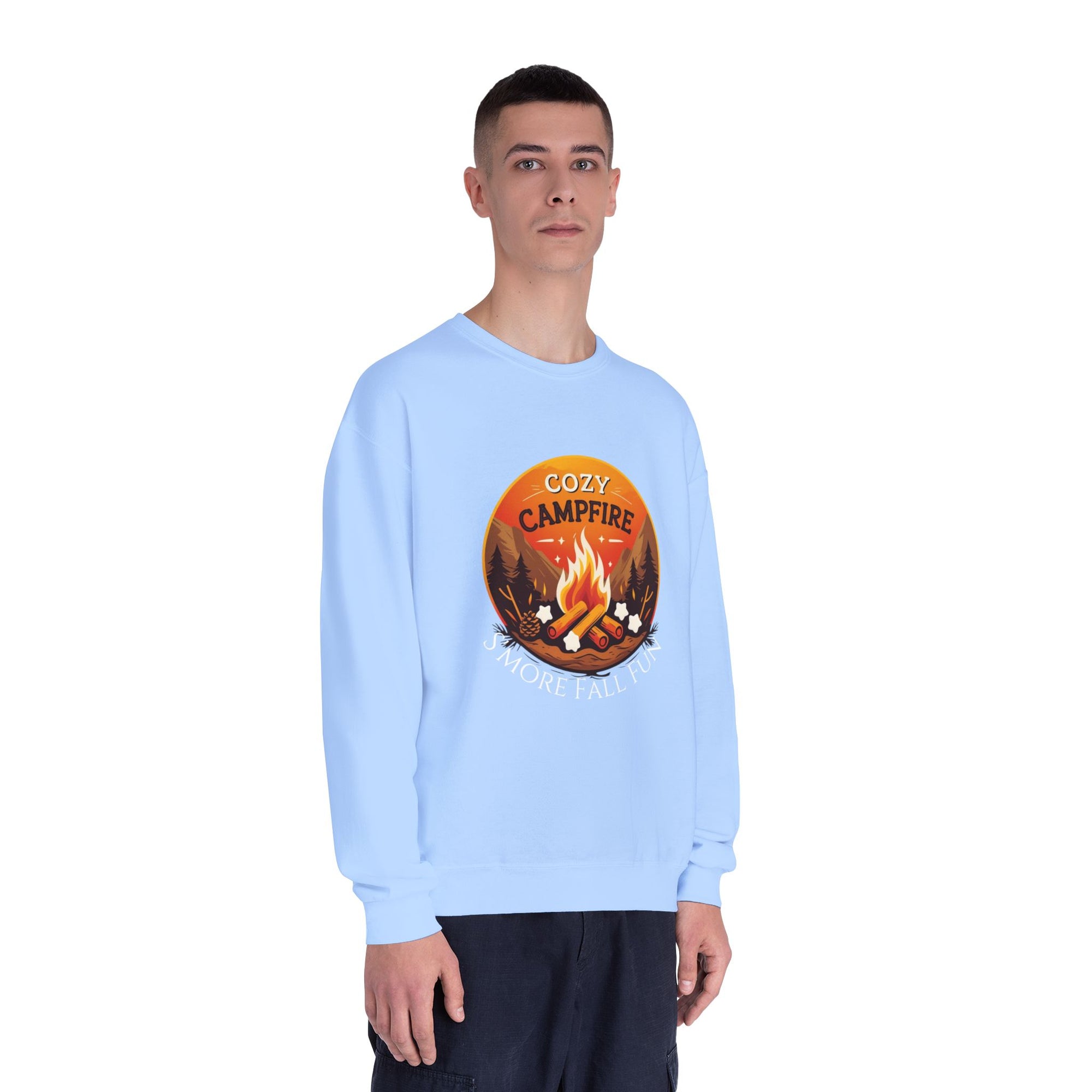 Person wearing a light blue sweatshirt with a &#39;Cozy Campfire&#39; graphic on a white background