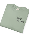 Folded gray t-shirt with 'MKD' text on a white background