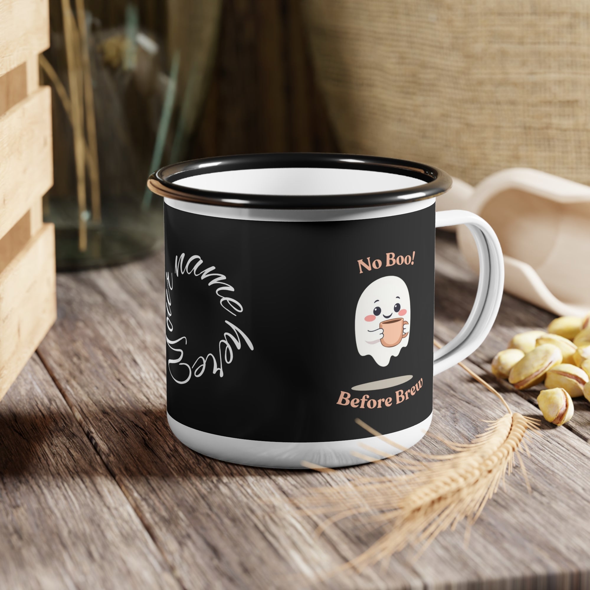 Black mug with ghost design and text on a wooden surface
