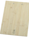 A rectangular bamboo cutting board with a natural light wood grain texture and two metal hanging loops at the top, shown on a plain white background.