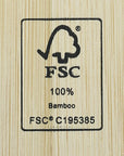 Close-up of a bamboo wood surface with a black FSC 100% Bamboo certification stamp.