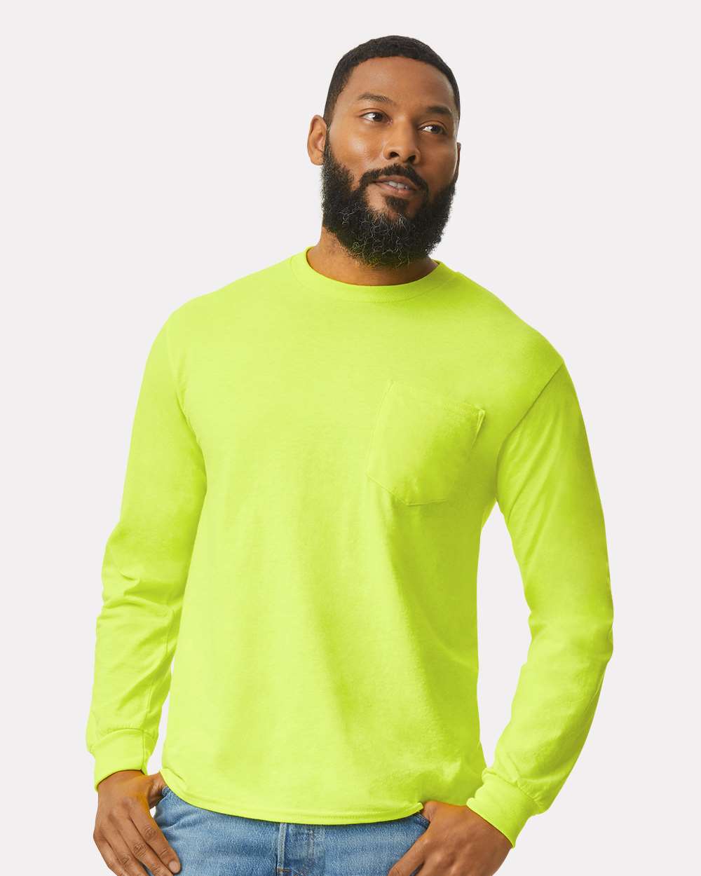Man wearing a bright green long-sleeve shirt on a white background
