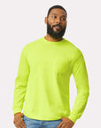 Man wearing a bright green long-sleeve shirt on a white background