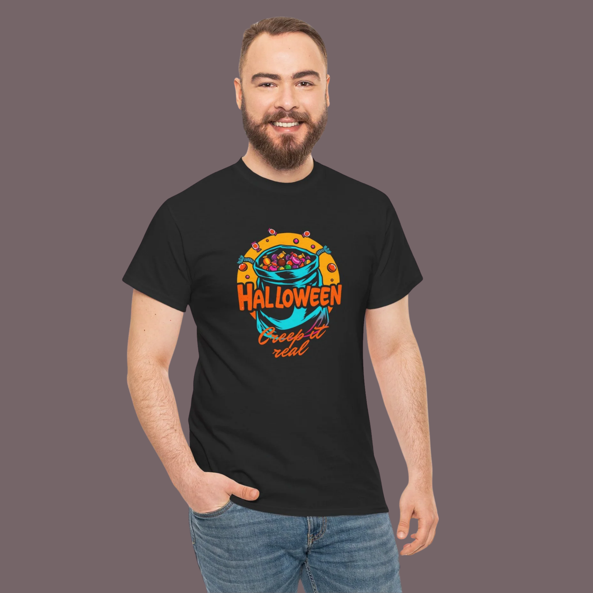 Man wearing a black t-shirt with Halloween-themed design on a plain background