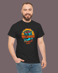 Man wearing a black t-shirt with Halloween-themed design on a plain background