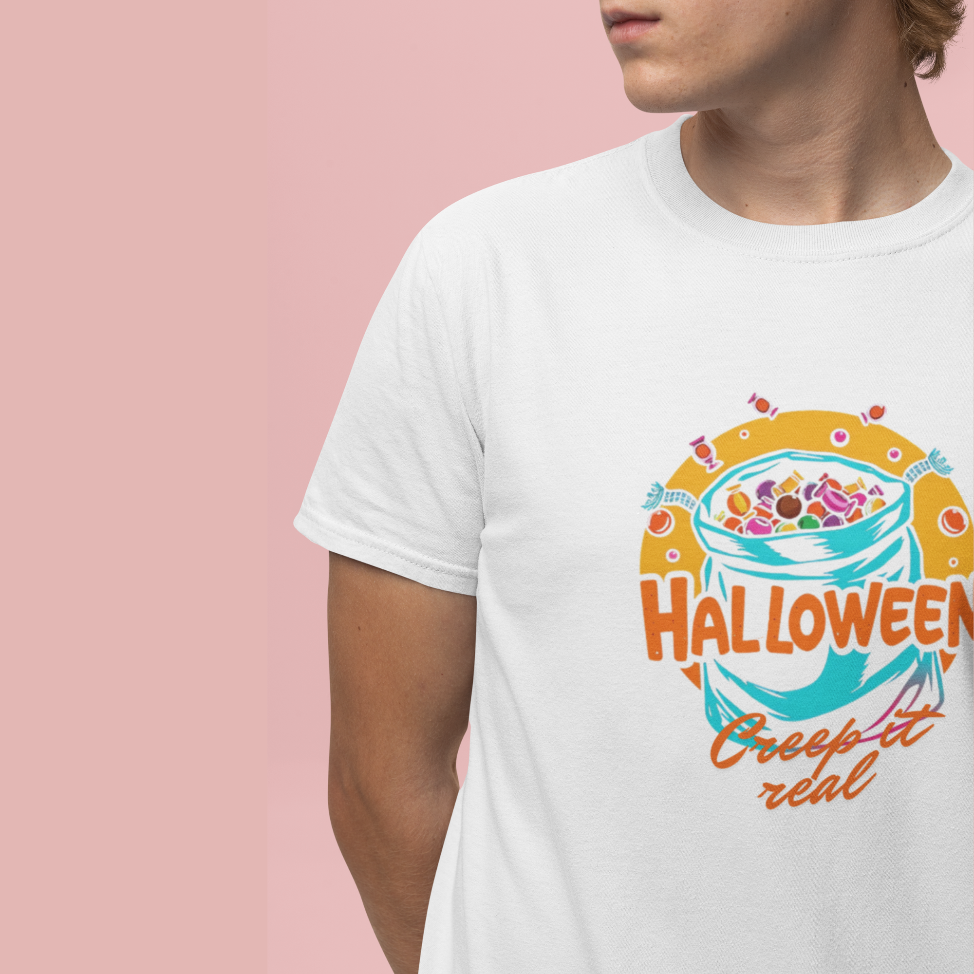 White t-shirt with Halloween-themed design on a pink background