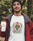 Man wearing a white t-shirt with 'Harvest Infinity' design, holding a white tumbler outdoors.