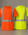 Orange and yellow high-visibility shirts with reflective stripes on a gray background
