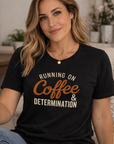 Woman wearing a black t-shirt with 'Running on Coffee & Determination' text in a casual setting.